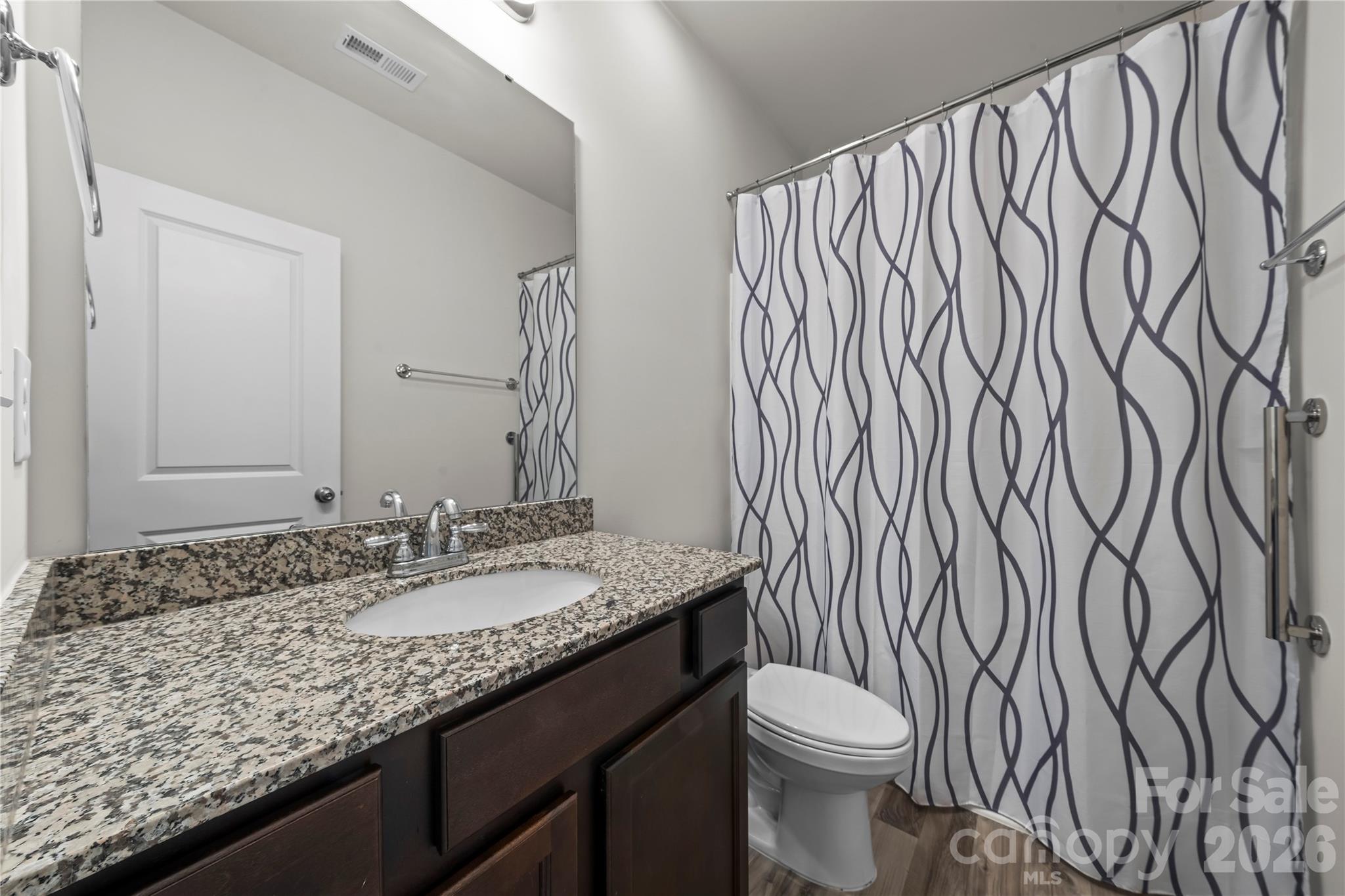 7380 Latham Way Denver, NC 28037 - Photo 24 of 39 a bathroom with a granite countertop sink and a mirror