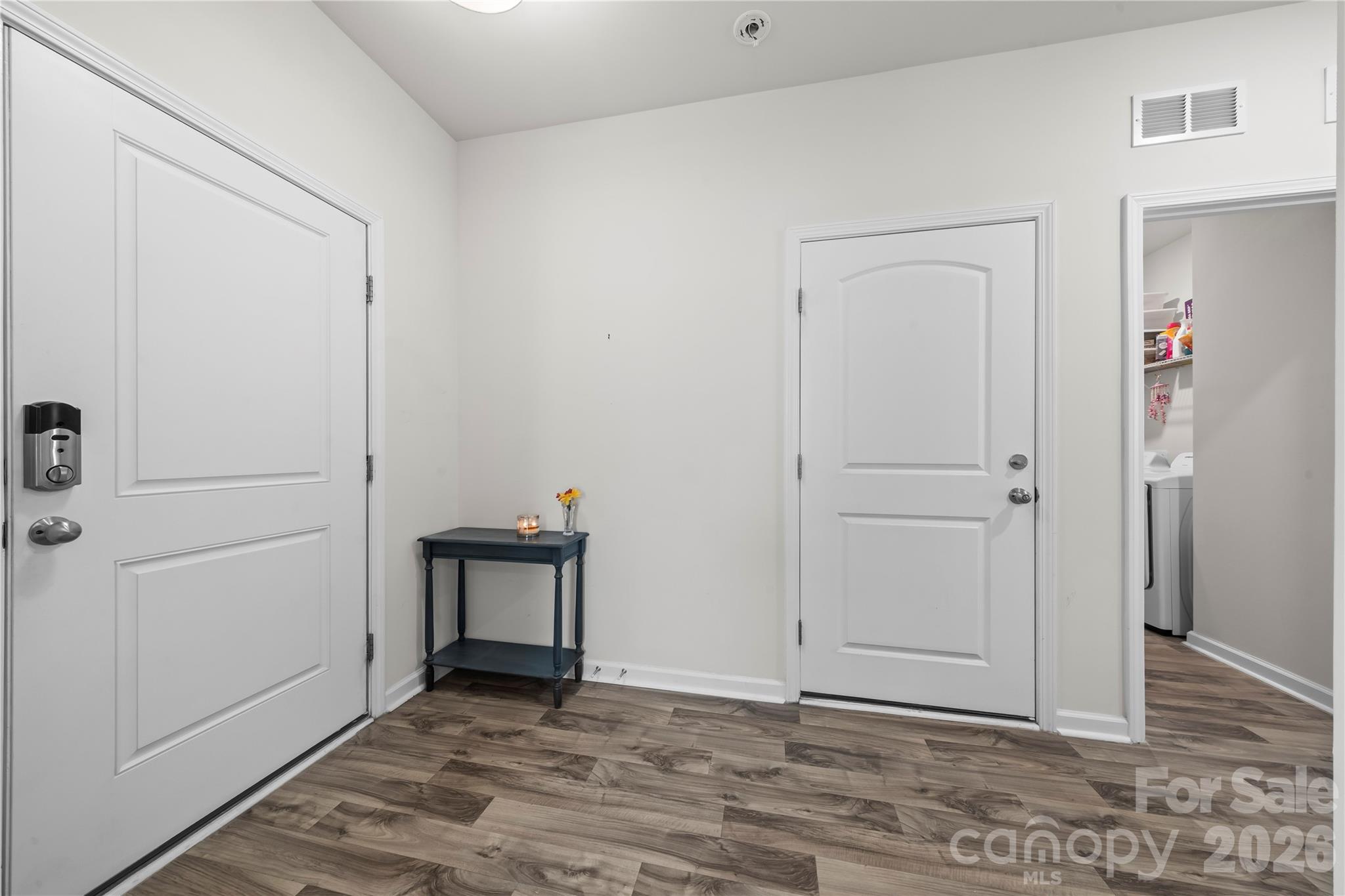 7380 Latham Way Denver, NC 28037 - Photo 25 of 39 a view of a livingroom with wooden floor and closet