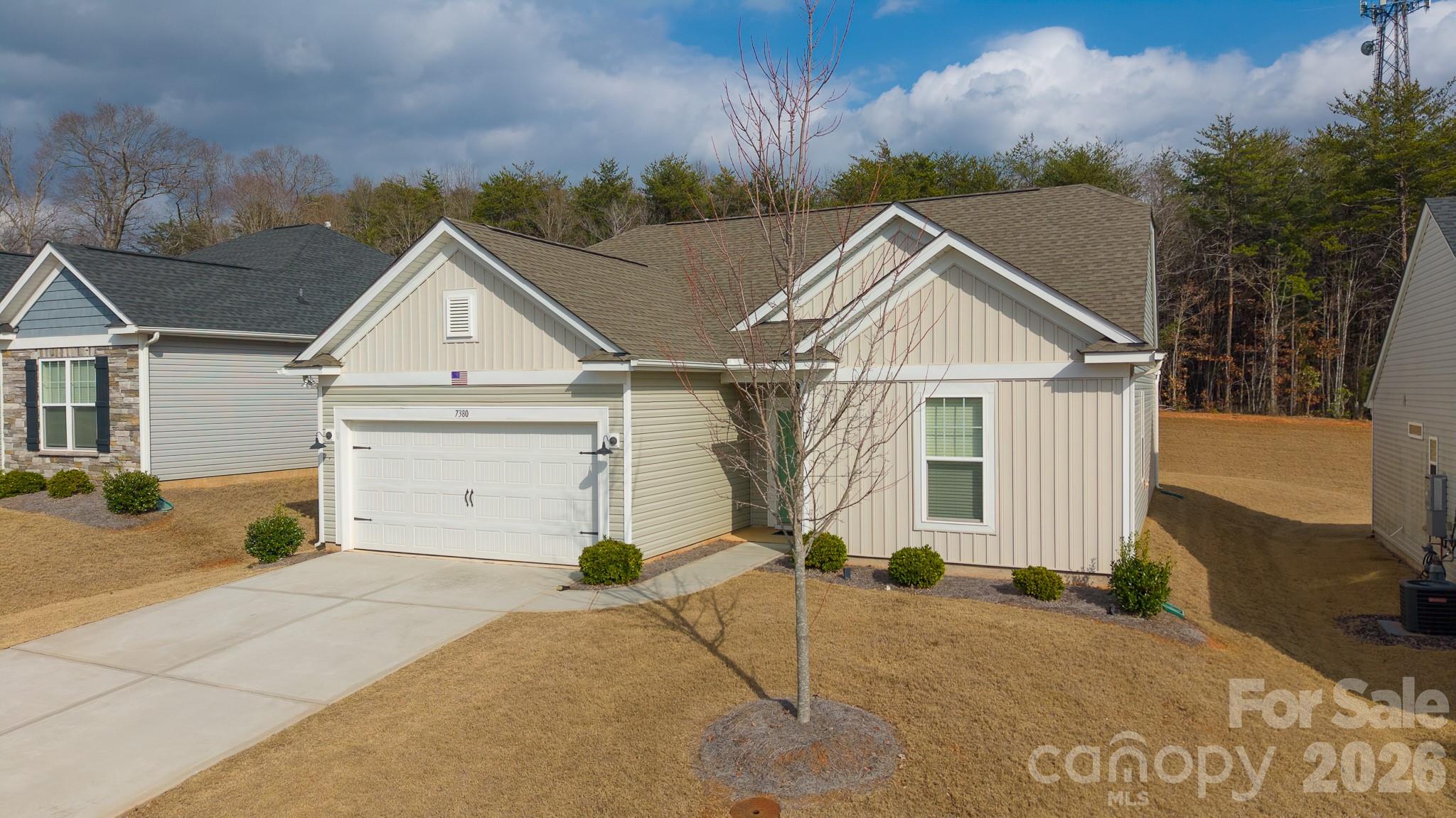 7380 Latham Way Denver, NC 28037 - Photo 38 of 39 a view of a house with a yard and garage