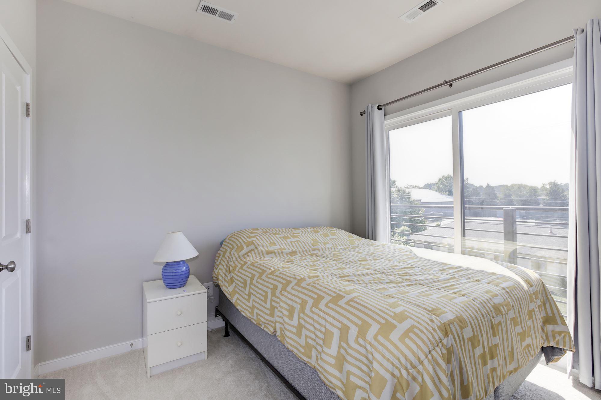 2957 Eskridge Road Fairfax, VA 22031 - Photo 15 of 30 a bedroom with a bed and window