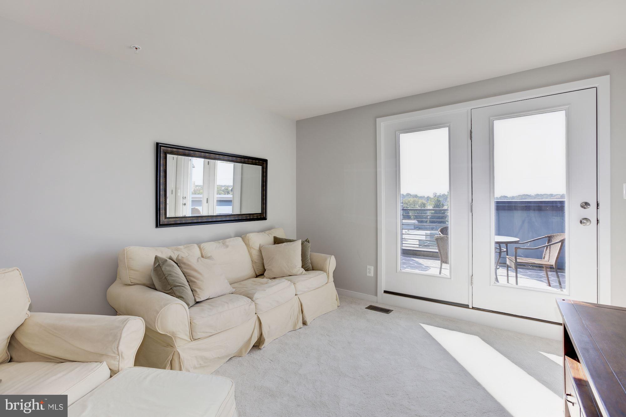 2957 Eskridge Road Fairfax, VA 22031 - Photo 18 of 30 a living room with furniture and a large window