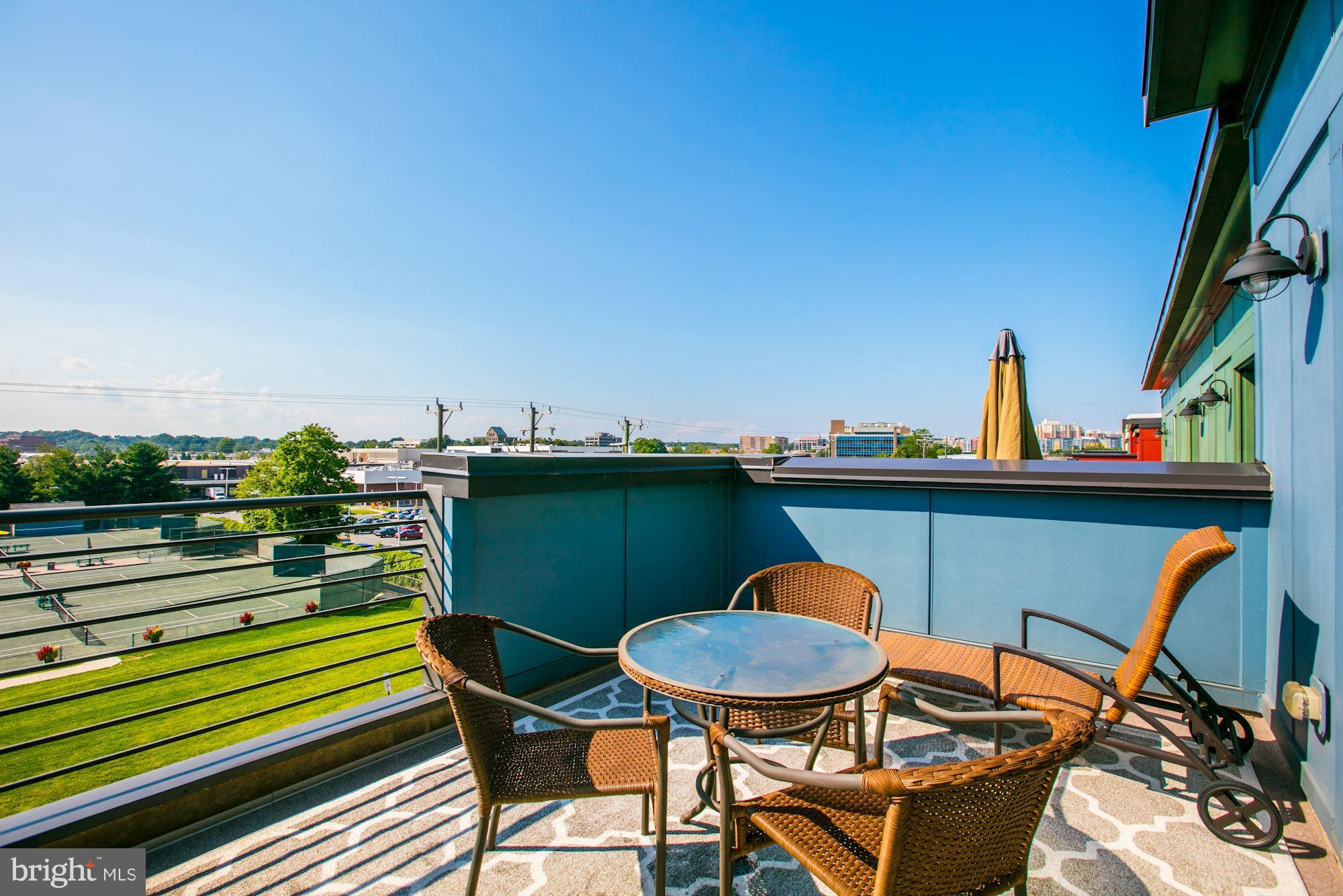 2957 Eskridge Road Fairfax, VA 22031 - Photo 23 of 30 a view of a chairs and table in the balcony