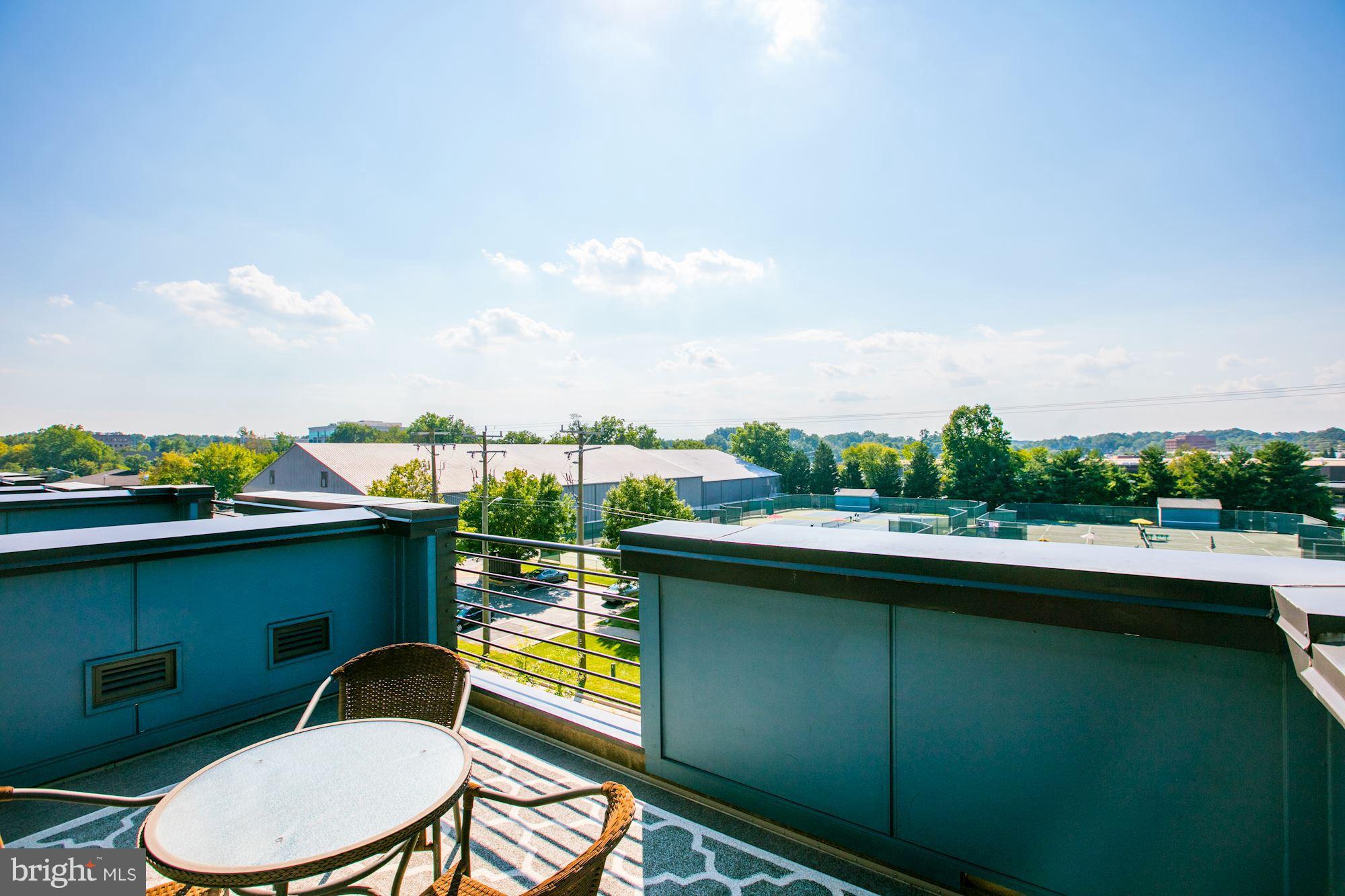 2957 Eskridge Road Fairfax, VA 22031 - Photo 25 of 30 a view of a chairs and table on the terrace