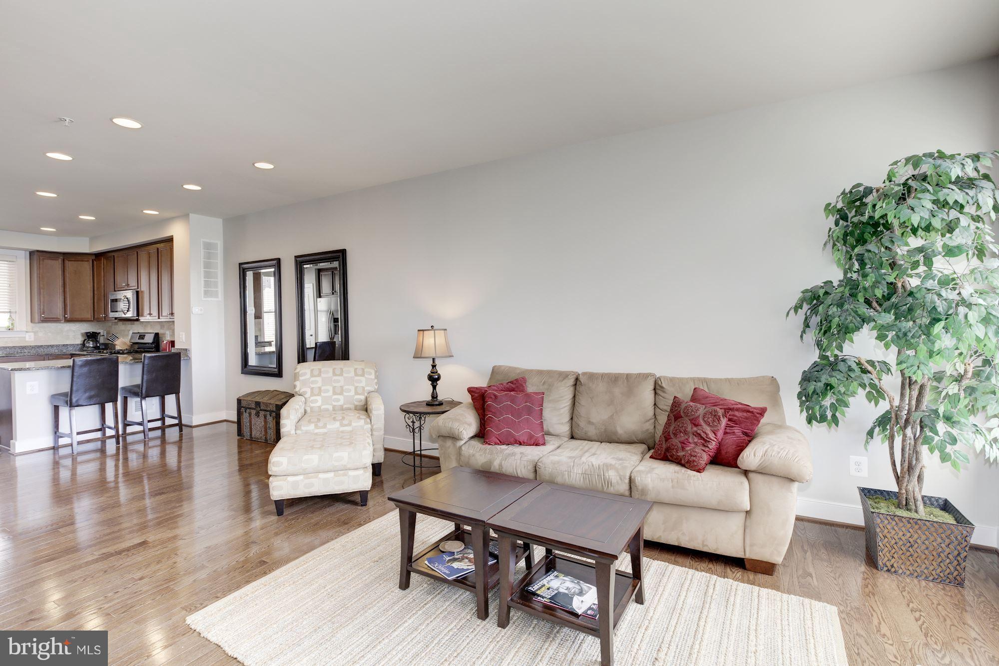 2957 Eskridge Road Fairfax, VA 22031 - Photo 8 of 30 a living room with furniture and a wooden floor