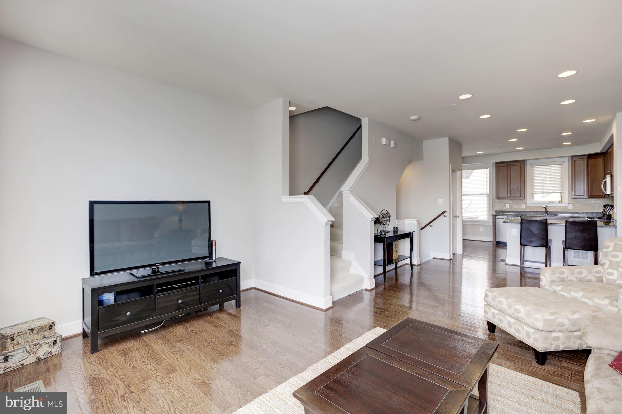 2957 Eskridge Road Fairfax, VA 22031 - Photo 9 of 30 a living room with furniture and a flat screen tv