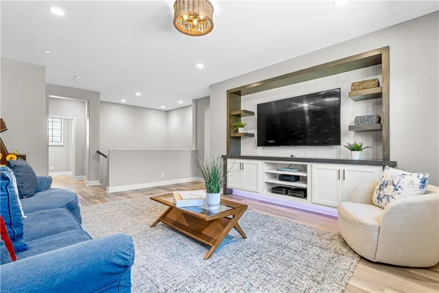a view of a livingroom with workspace and a window