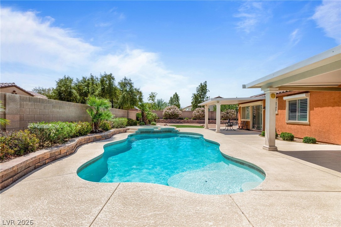 8431 Durango Ranch Court Las Vegas, NV 89113 - Photo 35 of 49 This private outdoor oasis features a refreshing pool, perfect for relaxation and entertaining.