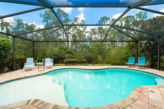 a view of a swimming pool with a patio