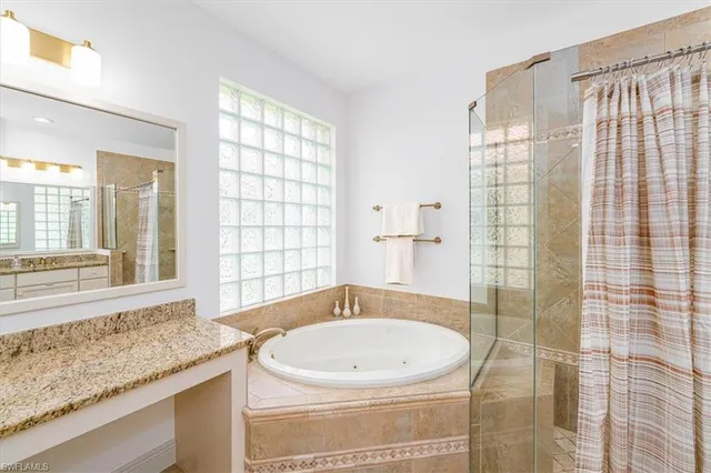 a bath tub sitting next to a window