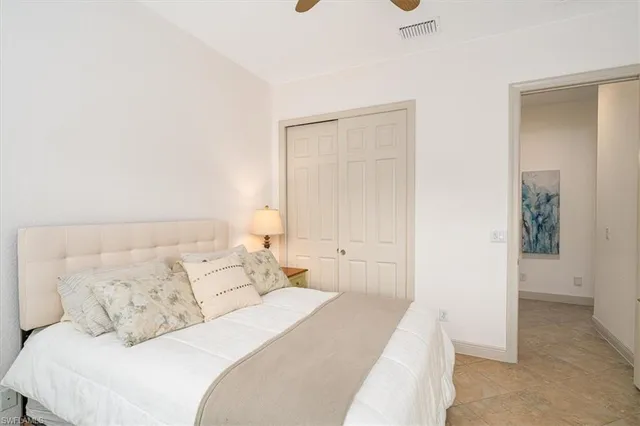 a bedroom with a bed and a cabinets