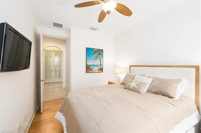 a bedroom with a bed and cabinets