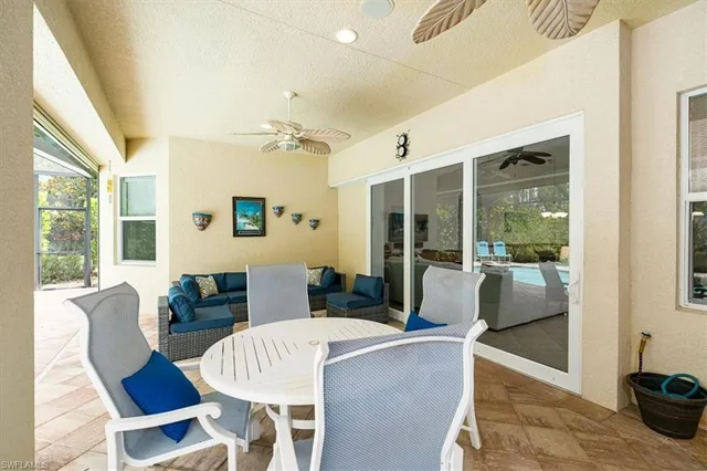 a view of a dining room with furniture window and outside view