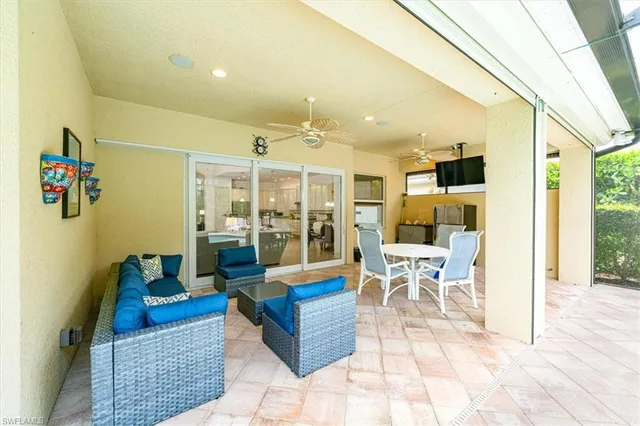 a living room with lots of furniture and a rug