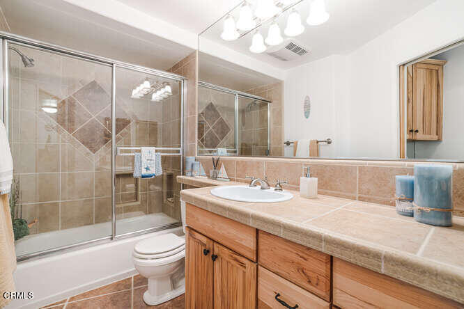 2901 Peninsula Road, Unit 132 Oxnard, CA 93035 - Photo 12 of 38 a bathroom with a sink a toilet and shower