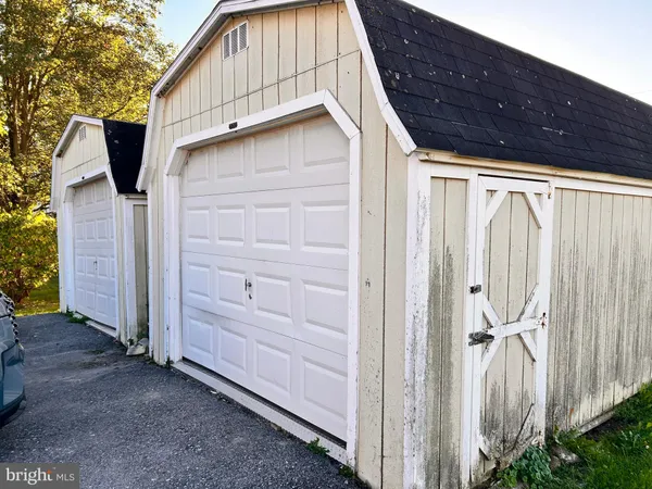 a view of a house with a backyard space