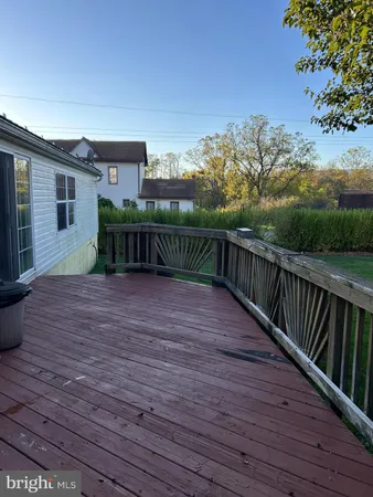 a view of a deck with a yard