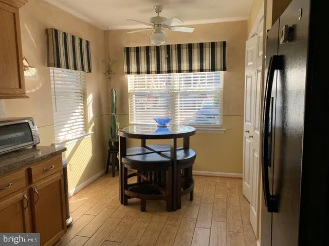 a view of a livingroom with furniture window and wooden floor