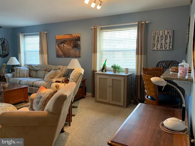 a bedroom with furniture and a wooden floor