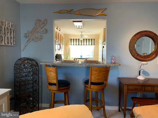 a bathroom with a toilet a sink and a mirror