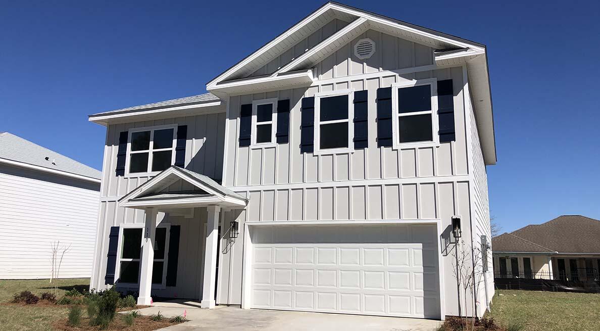 12096 East Harborview Road, Unit LOT 34 Santa Rosa Beach, FL 32459 - Photo 1 of 14 a front view of a house with a porch