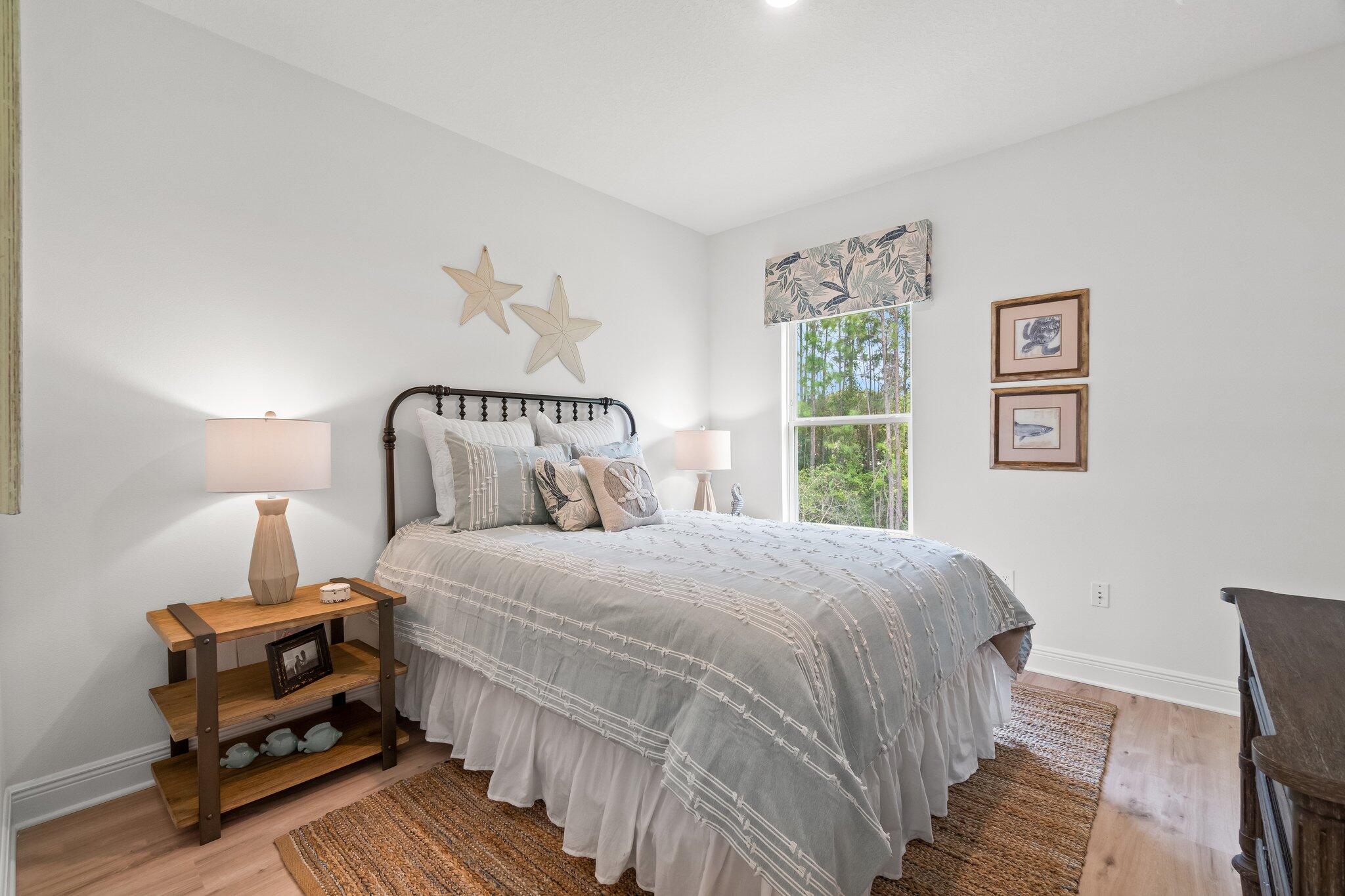 12096 East Harborview Road, Unit LOT 34 Santa Rosa Beach, FL 32459 - Photo 11 of 14 a bedroom with a bed and wooden floor