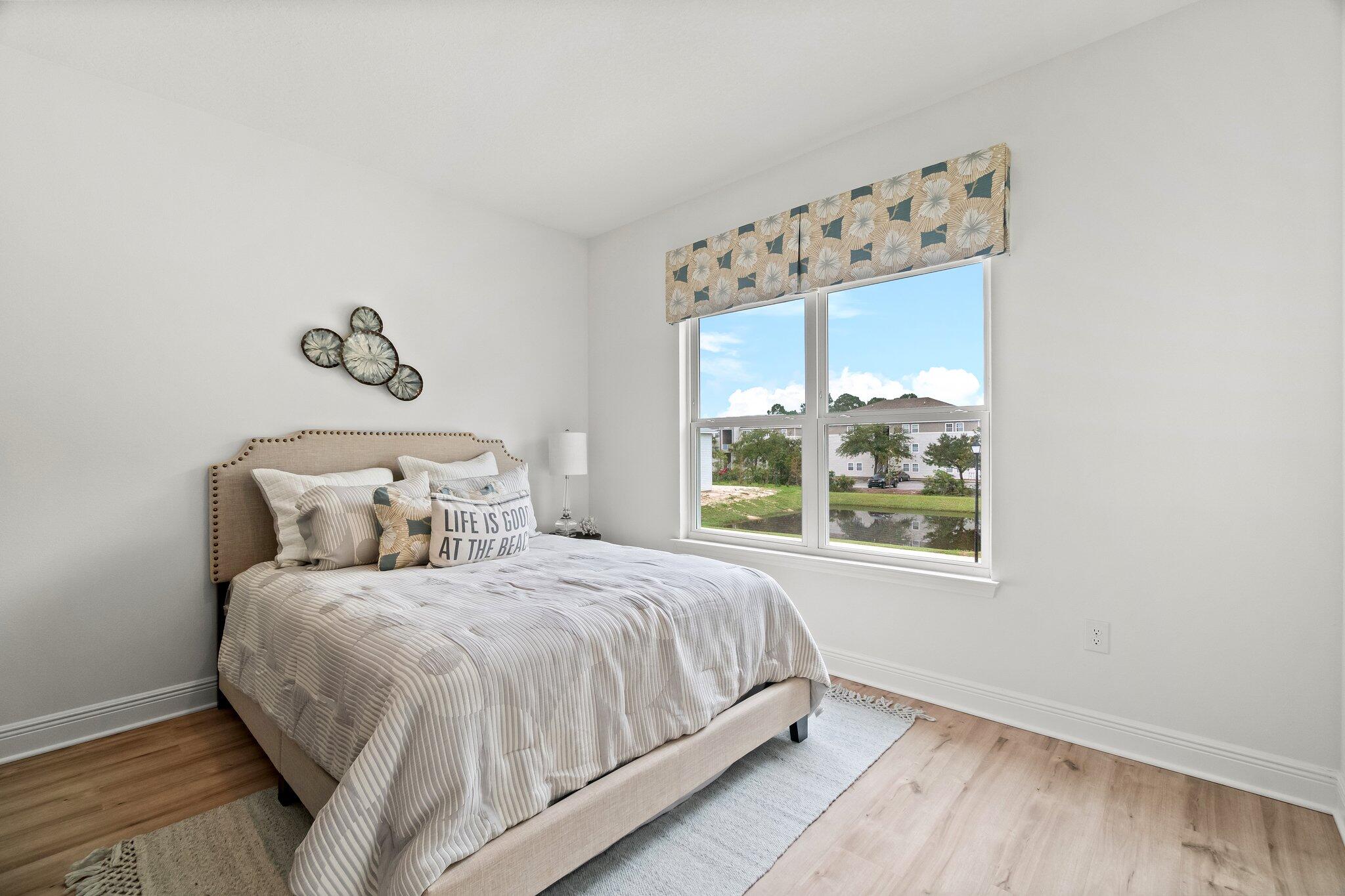 12096 East Harborview Road, Unit LOT 34 Santa Rosa Beach, FL 32459 - Photo 14 of 14 a bedroom with a bed and a window
