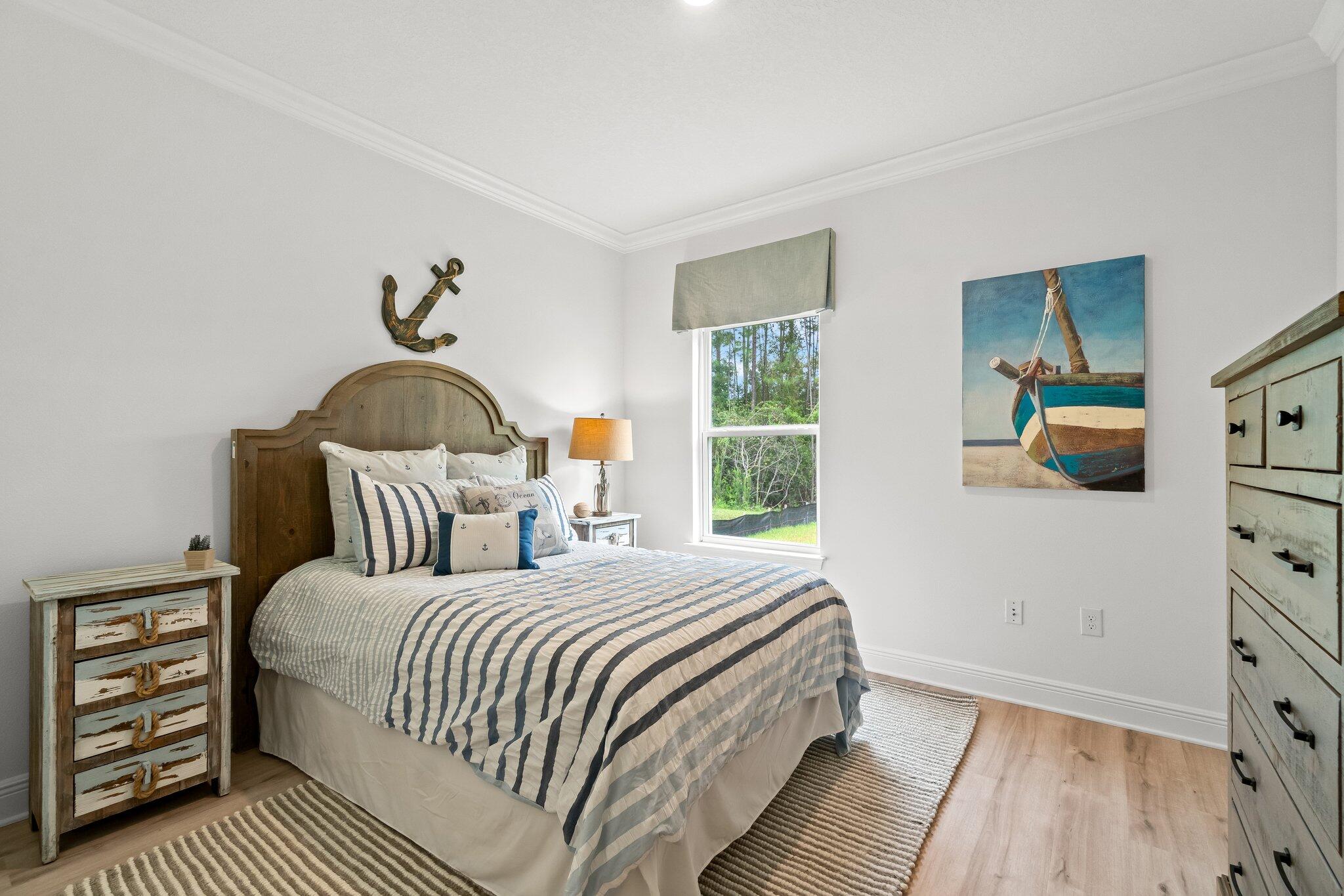 12096 East Harborview Road, Unit LOT 34 Santa Rosa Beach, FL 32459 - Photo 7 of 14 a bedroom with a bed and a dresser