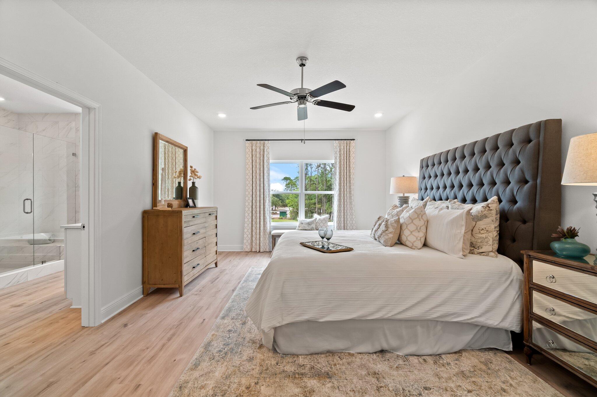 12096 East Harborview Road, Unit LOT 34 Santa Rosa Beach, FL 32459 - Photo 8 of 14 a bedroom with a bed and a chandelier