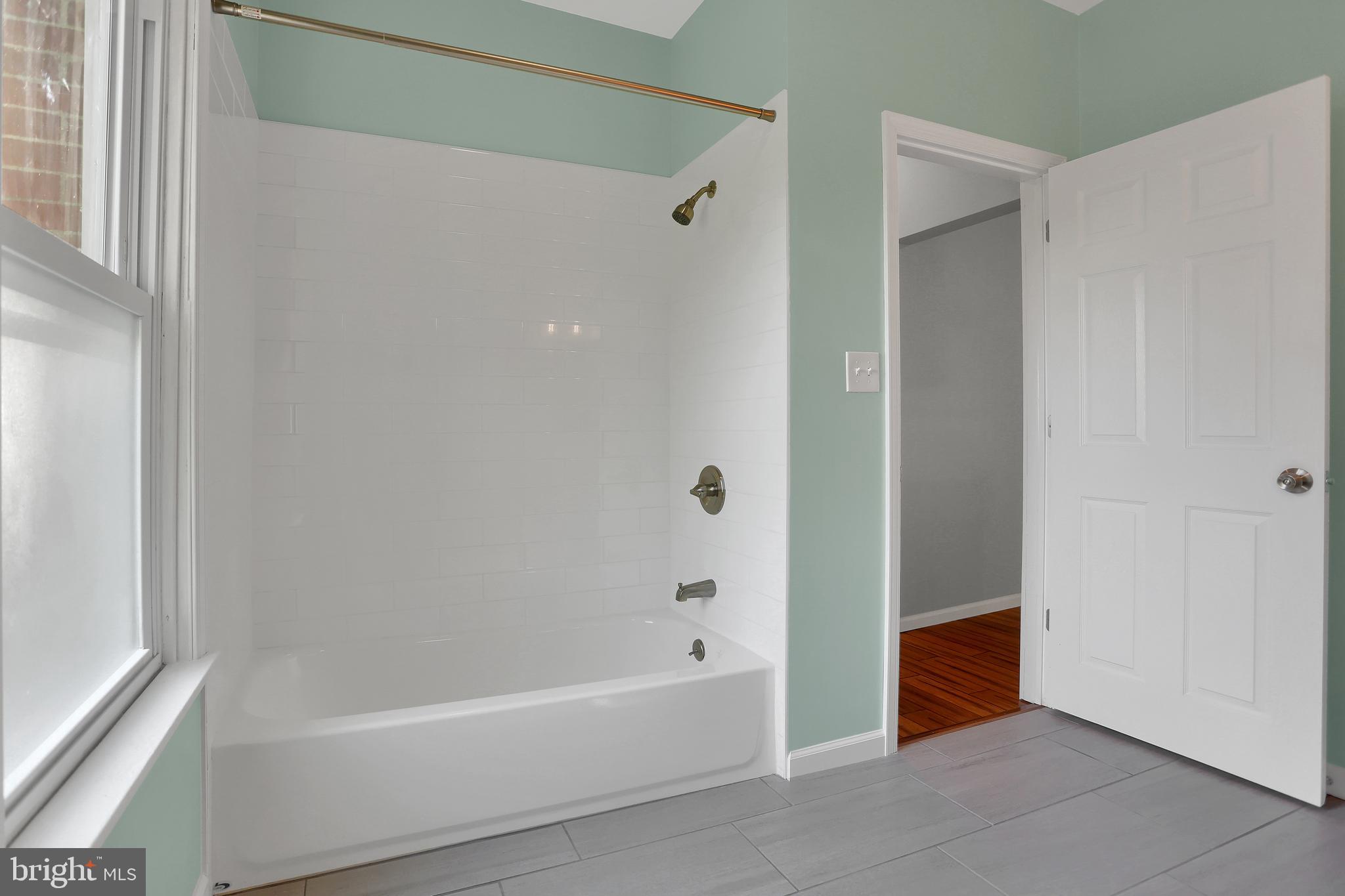 4735 Zeiglers Church Road Spring Grove, PA 17362 - Photo 22 of 60 a bathroom with a bathtub and a shower