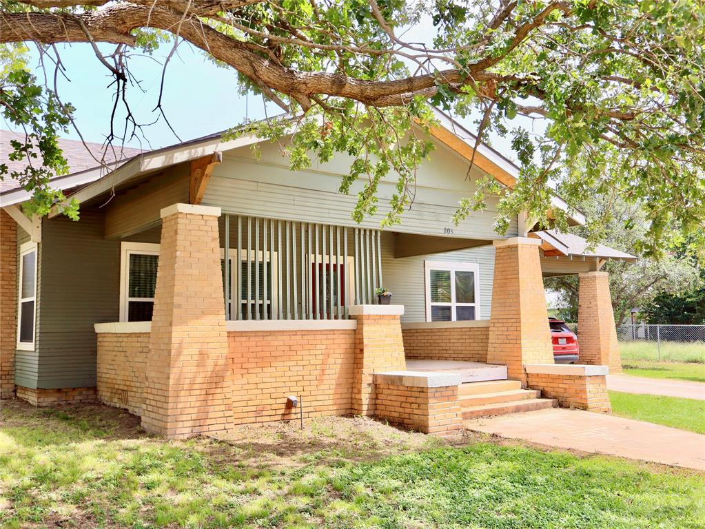 203 Bennett Street Strawn, TX 76475 - Photo 26 of 28 a front view of a house with a yard