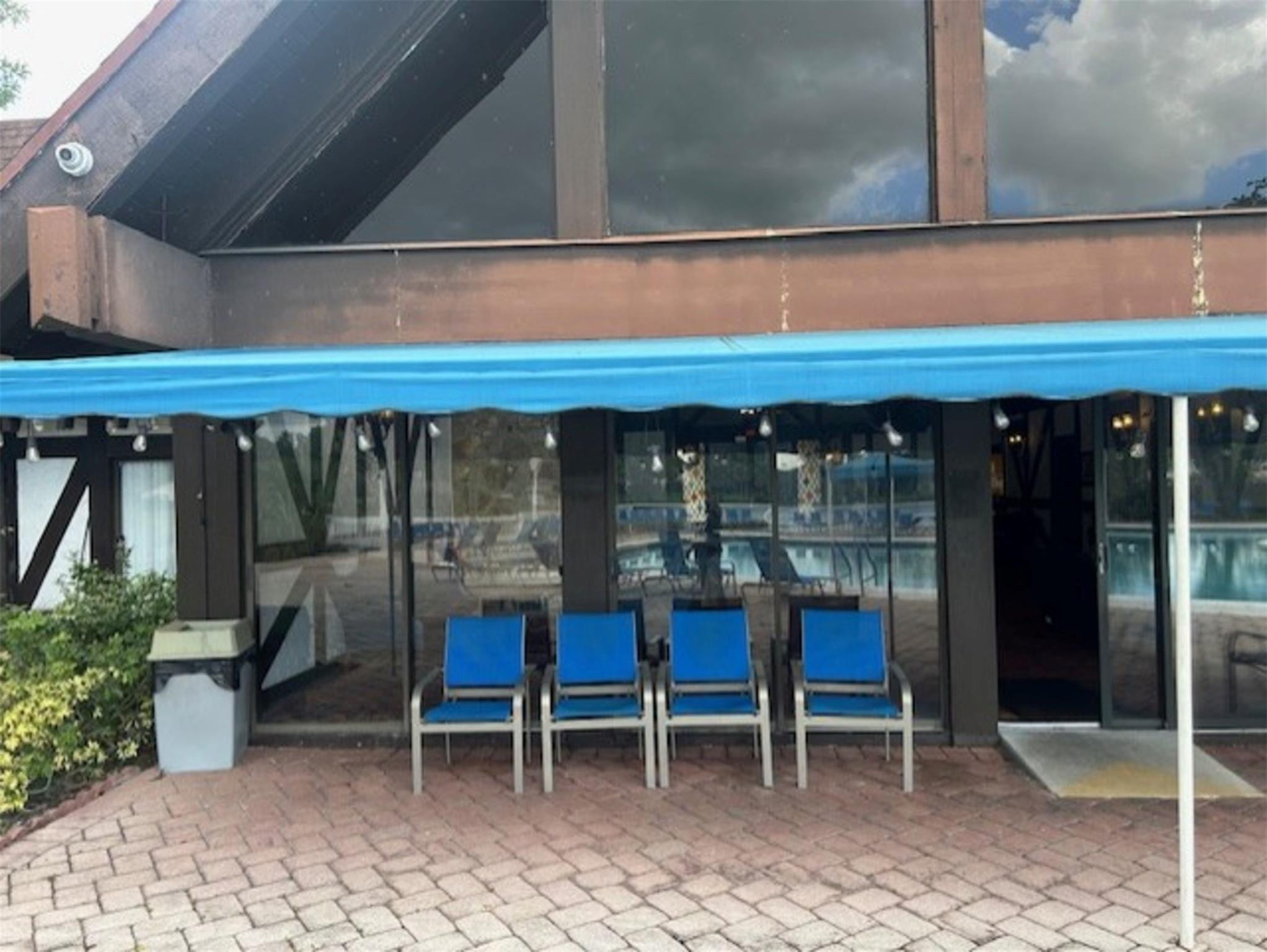 3720 Inverrary Drive, Unit 1T Lauderhill, FL 33319 - Photo 31 of 36 a view of a two chairs in the patio