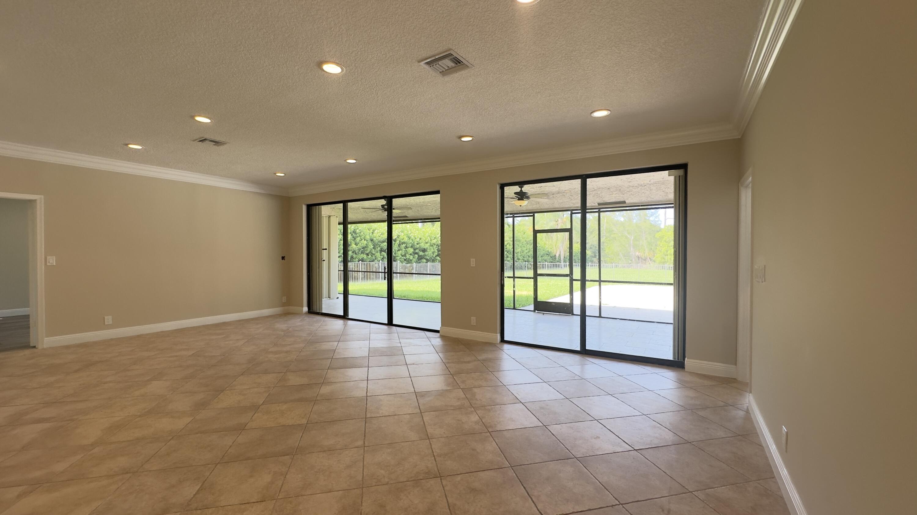 11330 Timber Lodge Terrace Boca Raton, FL 33428 - Photo 3 of 23 a view of an empty room with glass door