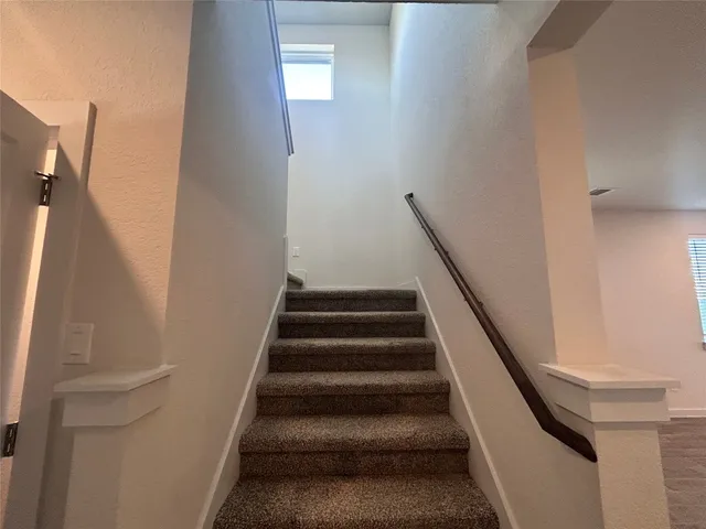 a view of an empty room with closet