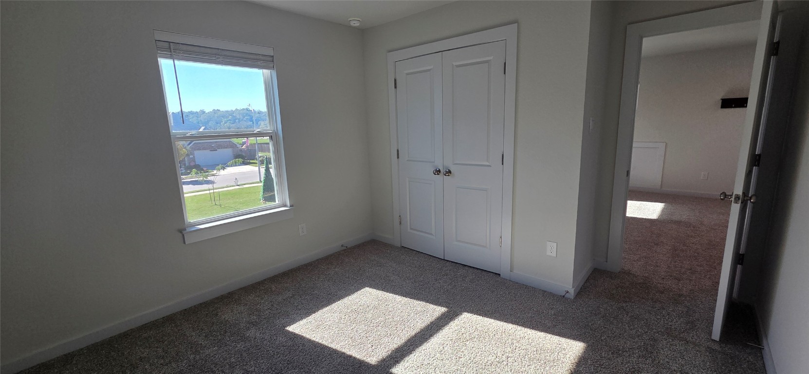 212 Whisper Rill Drive Hutto, TX 78634 - Photo 21 of 25 a view of an empty room with window and closet area
