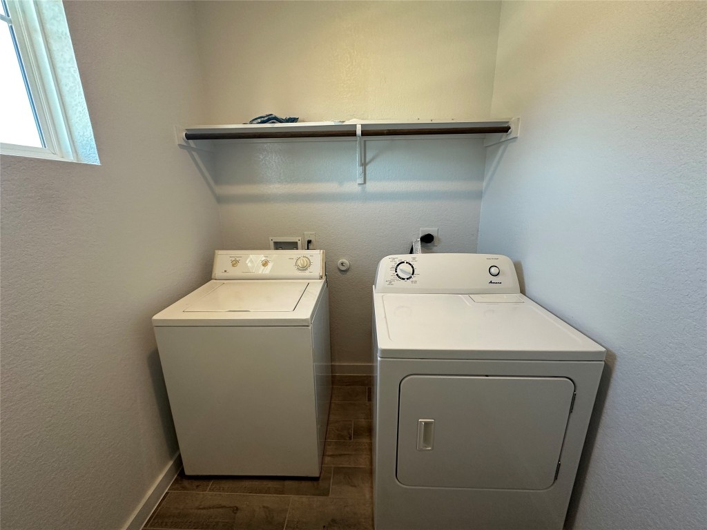 212 Whisper Rill Drive Hutto, TX 78634 - Photo 25 of 25 a utility room with dryer and washer