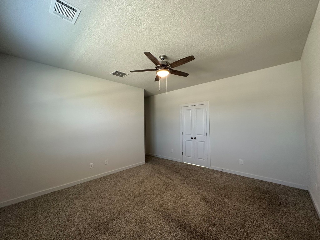 212 Whisper Rill Drive Hutto, TX 78634 - Photo 8 of 25 Primary Bedroom, door to the bathroom