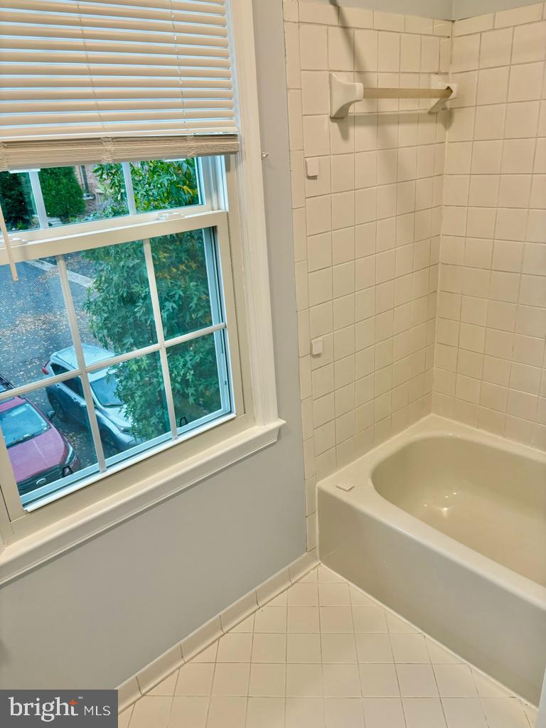 6803 Wild Rose Court Springfield, VA 22152 - Photo 14 of 49 a bathroom with a bathtub