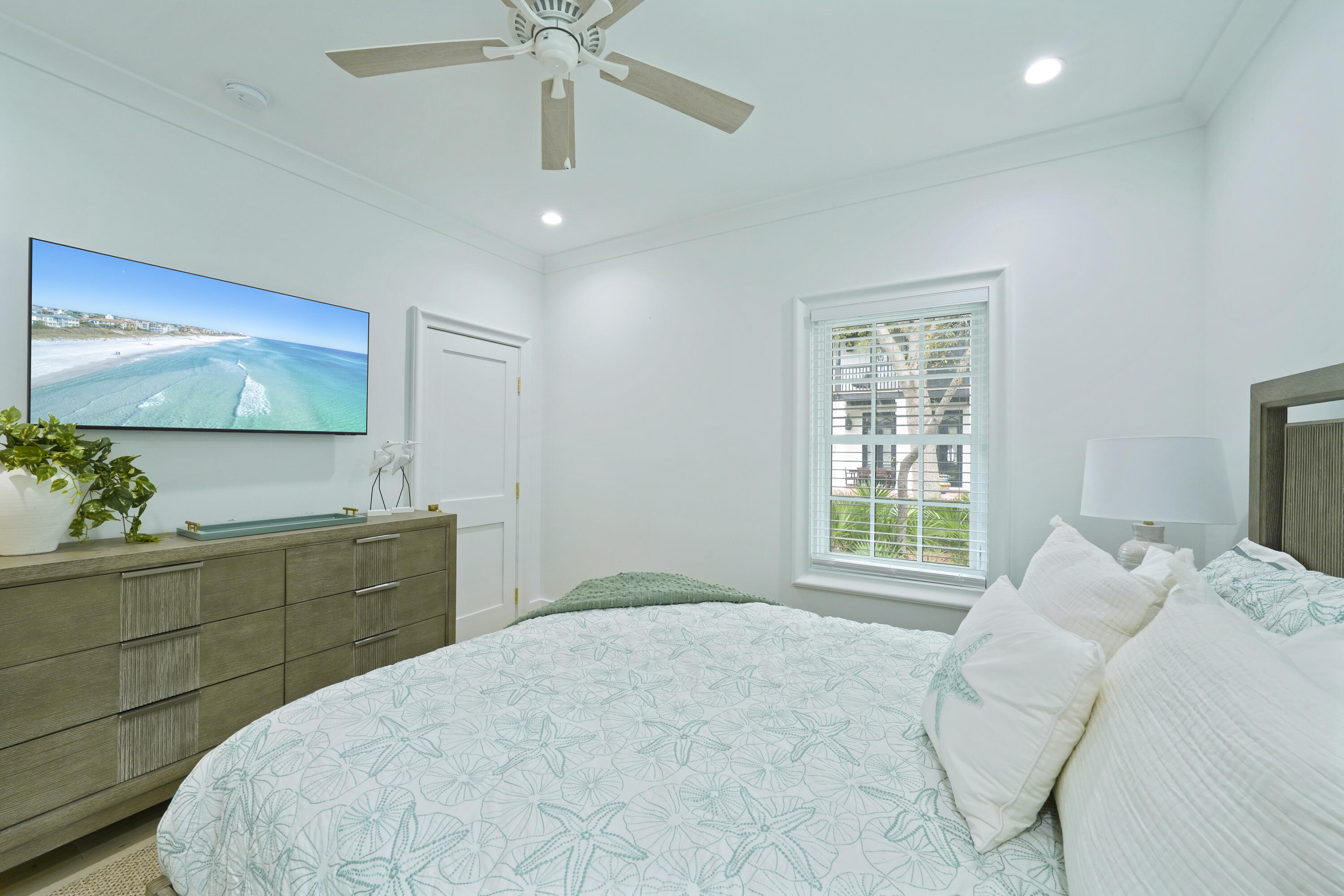 25 St George's Lane Inlet Beach, FL 32461 - Photo 14 of 54 a bedroom with a large bed and a flat tv screen on dresser