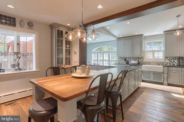 a kitchen with a table and chairs in it