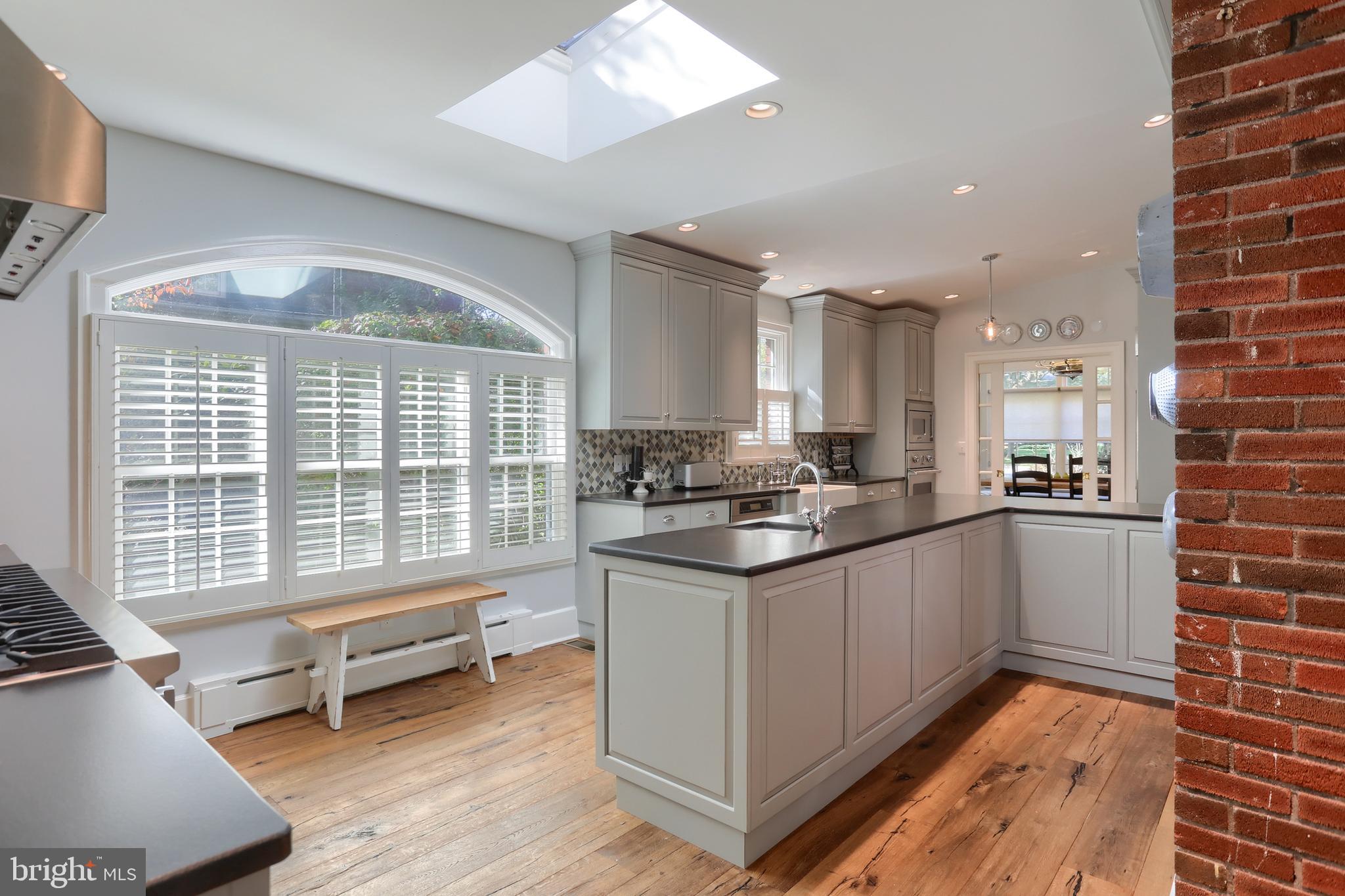 118 Elm Avenue Hershey, PA 17033 - Photo 14 of 54 a kitchen with stainless steel appliances granite countertop a stove a sink and a refrigerator