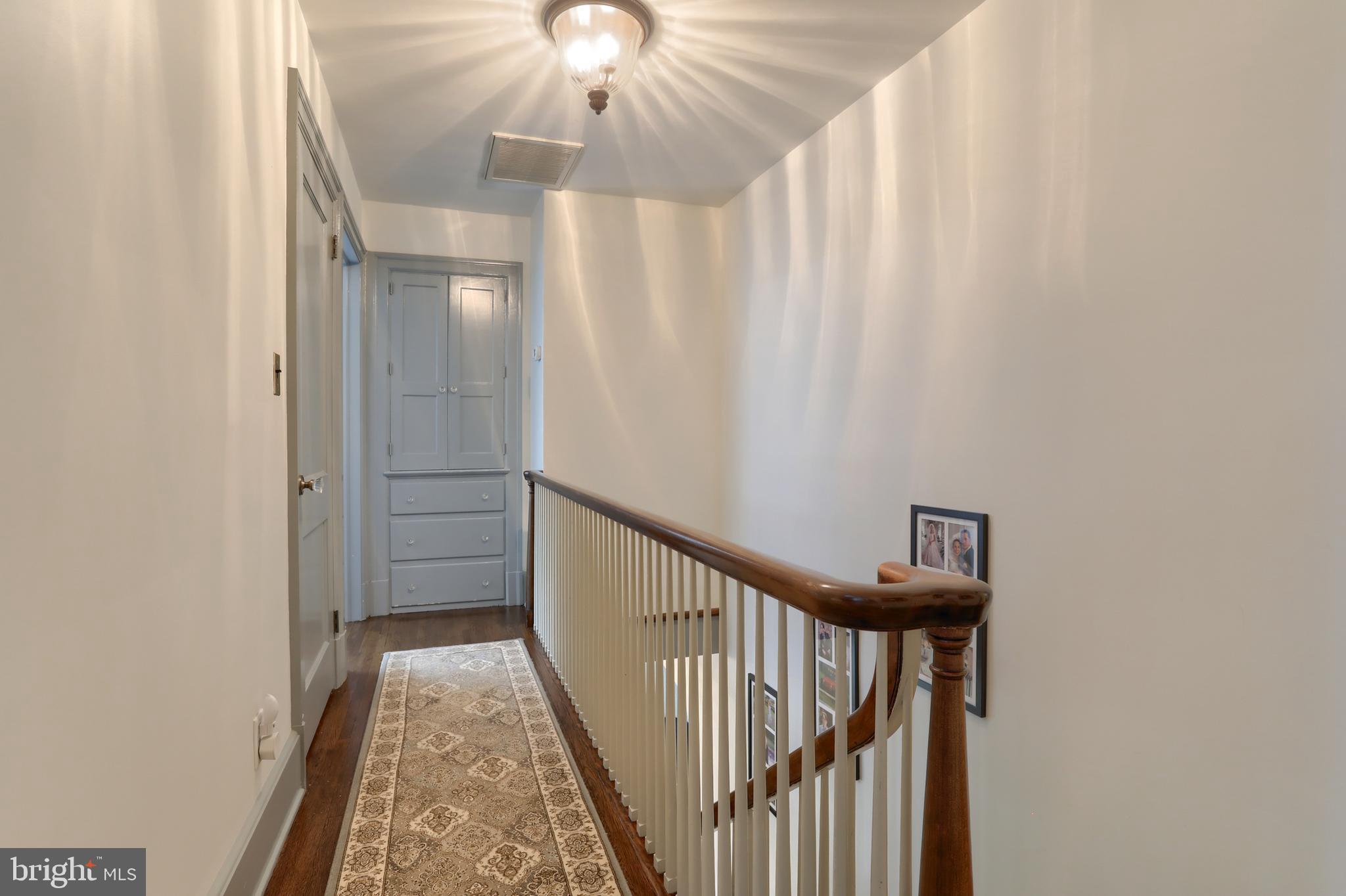 118 Elm Avenue Hershey, PA 17033 - Photo 22 of 54 a view of a hallway with a window and a chandelier
