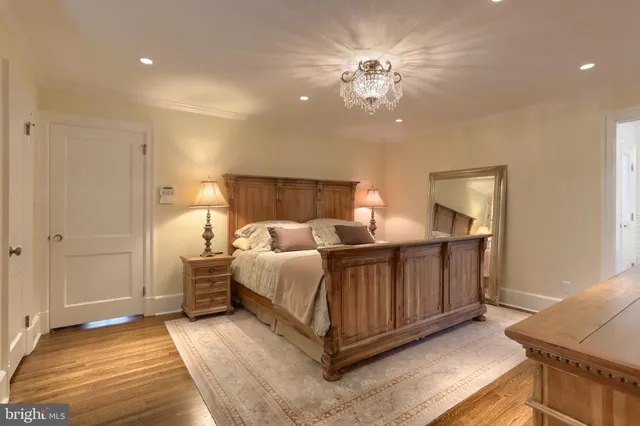 a bedroom with a bed and a television