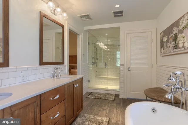 a bedroom with a bed a window and closet