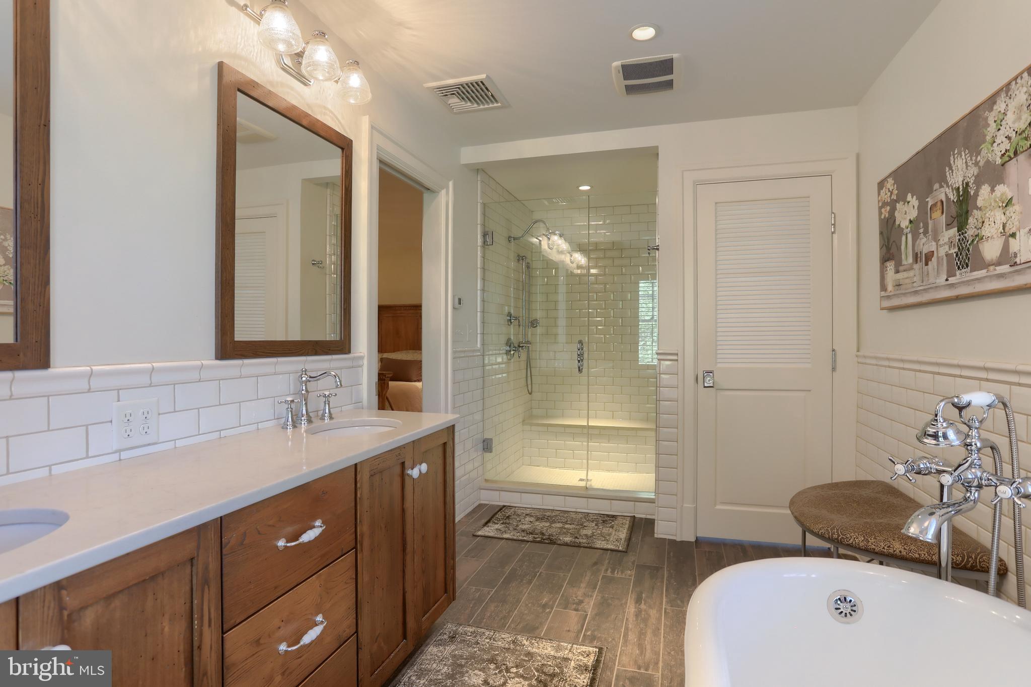 118 Elm Avenue Hershey, PA 17033 - Photo 28 of 54 a bathroom with a tub sink mirror and a shower