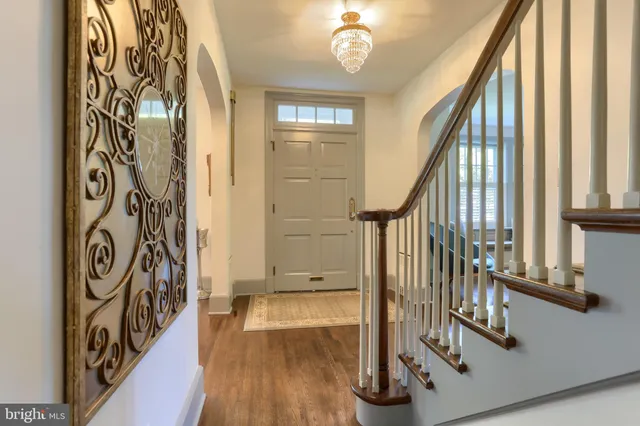 a view of an entryway with wooden floor