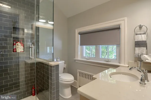 a bedroom with furniture and windows