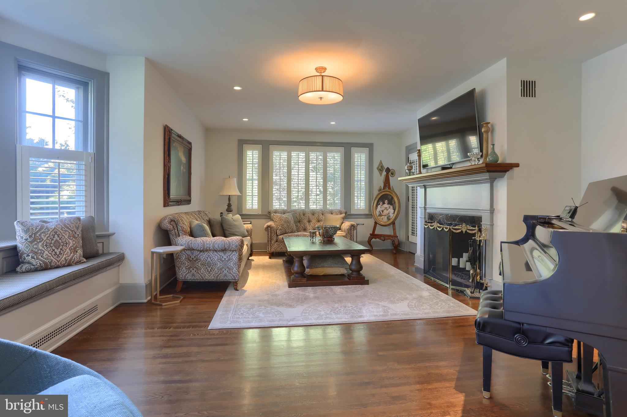 118 Elm Avenue Hershey, PA 17033 - Photo 4 of 54 a living room with furniture a fireplace and a flat screen tv