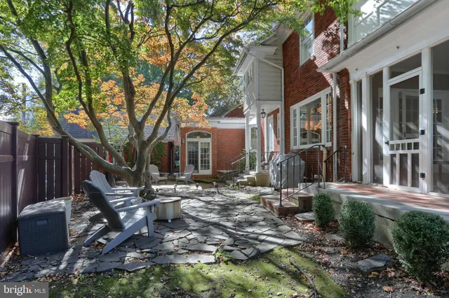 a view of a house with backyard sitting area and porch