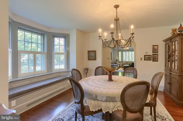 a large kitchen with stainless steel appliances lots of counter space and a sink