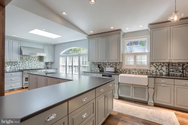 a kitchen with a sink and center island